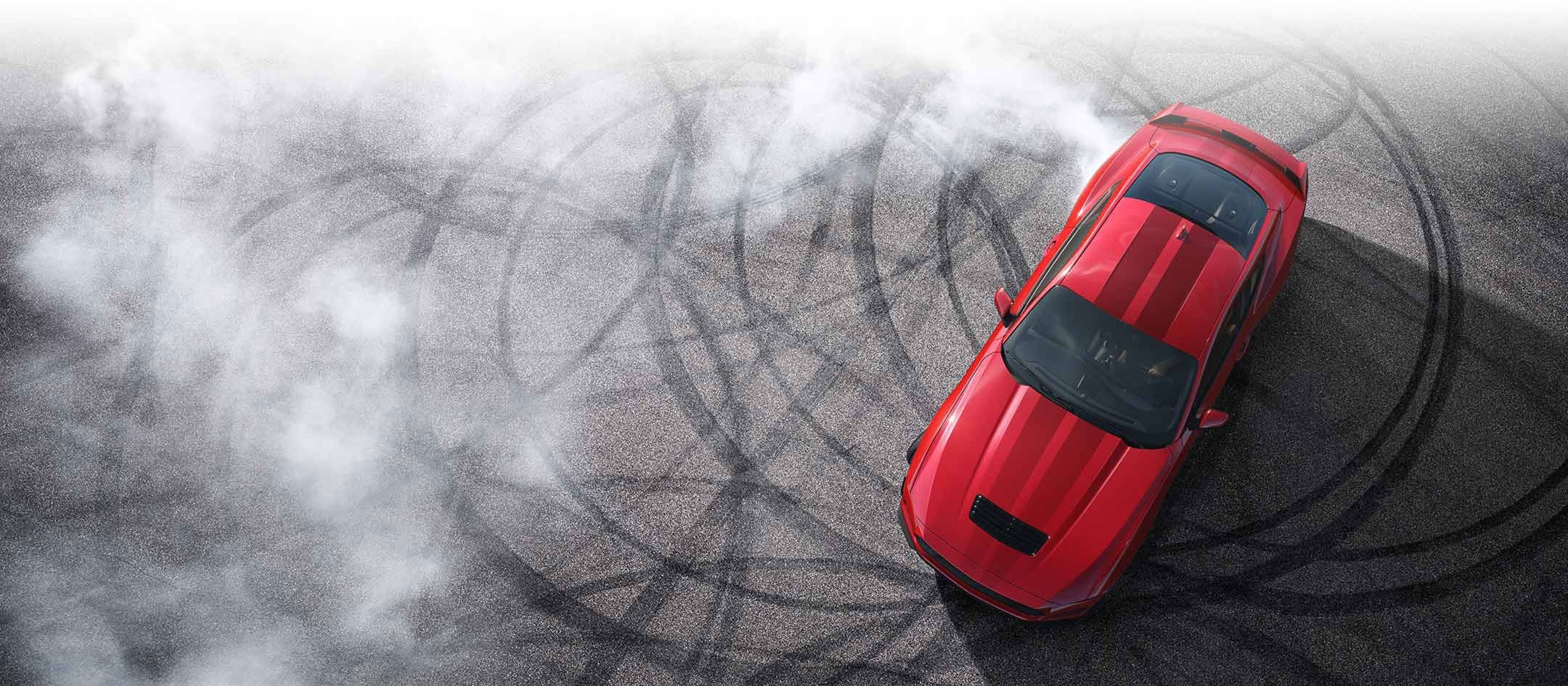Overhead view of a 2024 Ford Mustang® model with tire tracks on pavement | Jordan Ford in Mishawaka IN